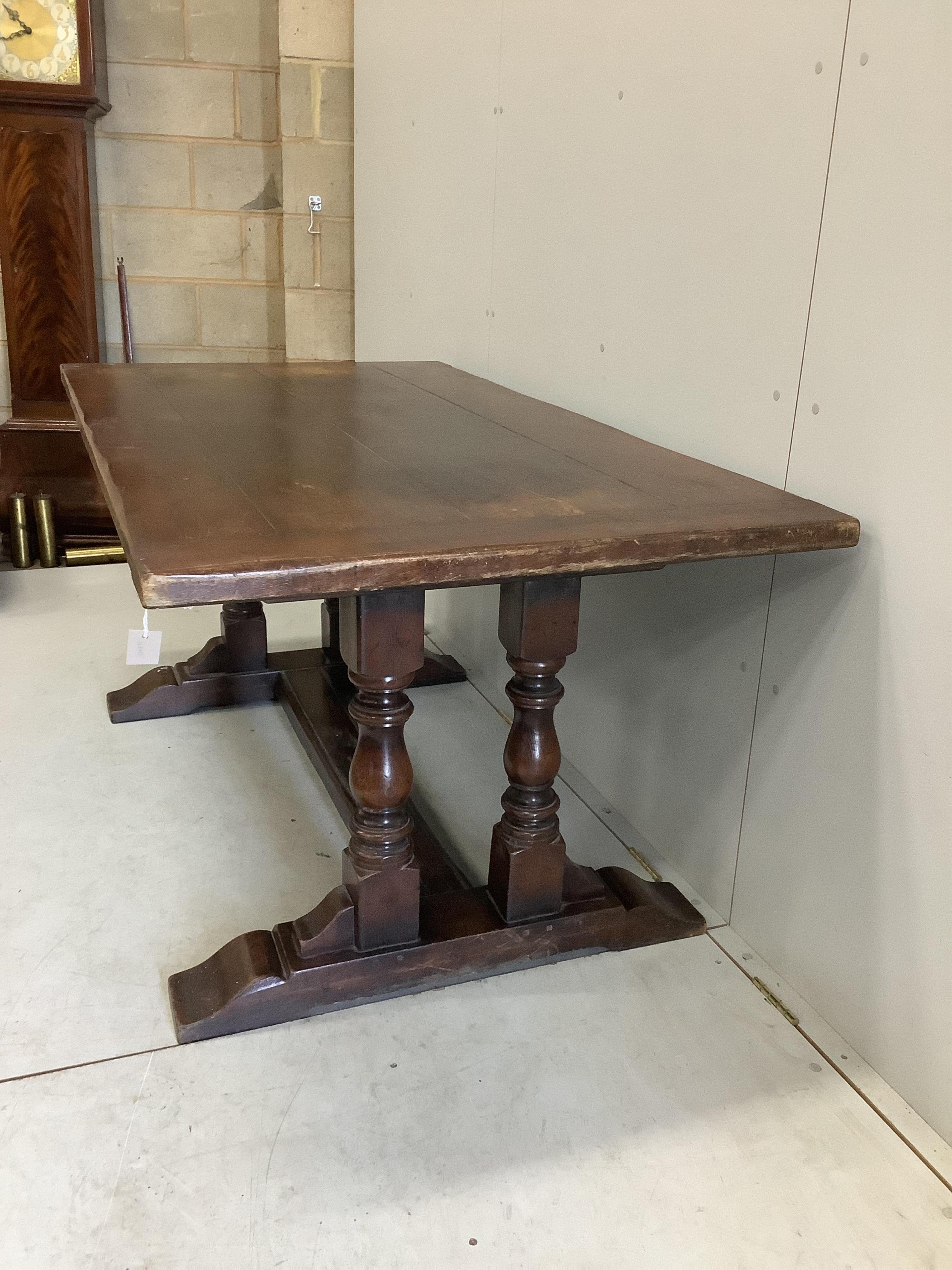 An 18th century style rectangular oak refectory dining table, width 167cm, depth 91cm, height 77cm. Condition - fair, top faded in several places